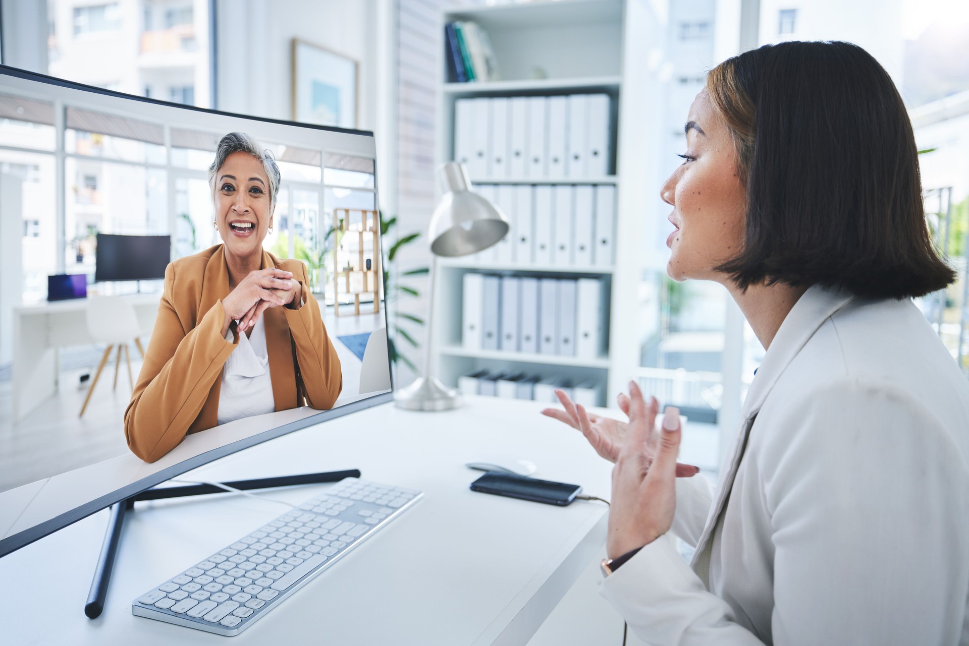 Business woman, video call and computer screen for online meeting, manager feedback and planning in office. Professional employees, b2b clients or mentor in virtual communication of support or advice